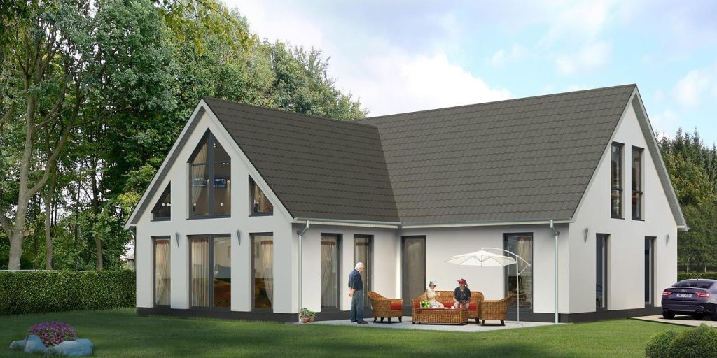 Moderne luxe villa met grote ramen en natuurlijke omgeving, voorbeeld van hoe je droomhuis in een luxe villa kunt transformer
